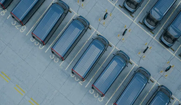 aerial image of delivery vans charging